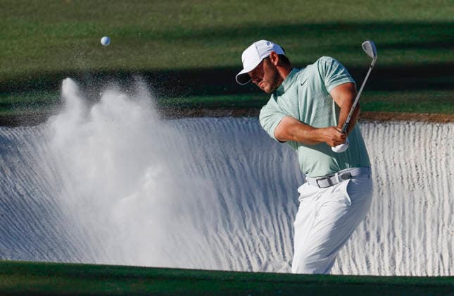 Jordan Spieth hits out of a bunker on the 16th hole during the first day of the Masters Tournament at Augusta National Golf Club on Thursday, April 9, 2026, in Augusta, Georgia.  AUG20260409787 JOHNxANGELILLO