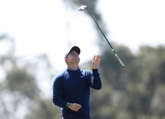 Rory McIlroy of Northern Ireland tosses his club after his tee shot on the 4th hole during the first day of the Masters Tournament at Augusta National Golf Club on Thursday, April 9, 2026, in Augusta, Georgia.  AUG20260409745 JOHNxANGELILLO
