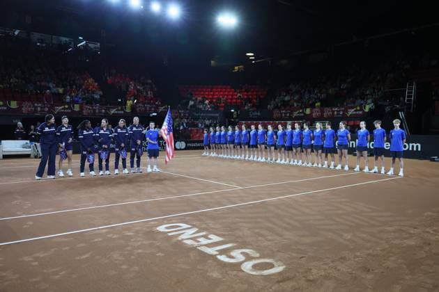 Teams pictured at the start of the first game between Belgian Vandewinkel WTA, Tennis Damen 94) and US Jovic (WTA 16) on the first day of tennis matches between Belgium and USA, in the qualifiers of the Billie Jean King Cup tennis, in Oostende, Belgium, on Friday 10 April 2026. The meeting takes place on 10 and 11th April. PHOTO BENOITxDOPPAGNE  x170399595x