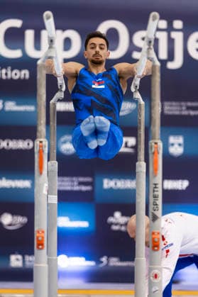 DOBRO FIG Apparatus World Cup Osijek 2026 Qualifications Petar Vefic of Serbia performs on the parallel bars during the DOBRO FIG Apparatus World Cup Osijek 2026 Qualifications at Sports Hall Gradski vrt on April 10, 2026. in Osijek, Croatia.  DavorxJavorovic PIXSELL