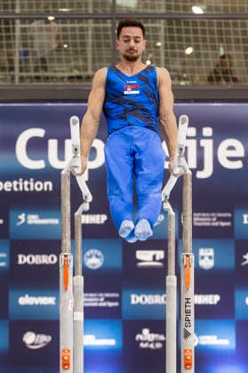 DOBRO FIG Apparatus World Cup Osijek 2026 Qualifications Petar Vefic of Serbia performs on the parallel bars during the DOBRO FIG Apparatus World Cup Osijek 2026 Qualifications at Sports Hall Gradski vrt on April 10, 2026. in Osijek, Croatia.  DavorxJavorovic PIXSELL
