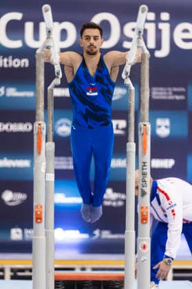 DOBRO FIG Apparatus World Cup Osijek 2026 Qualifications Petar Vefic of Serbia performs on the parallel bars during the DOBRO FIG Apparatus World Cup Osijek 2026 Qualifications at Sports Hall Gradski vrt on April 10, 2026. in Osijek, Croatia.  DavorxJavorovic PIXSELL