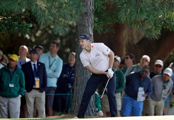Justin Rose of England watches his second shot on the 1st hole during the second day of the Masters Tournament at Augusta National Golf Club on Friday, April 10, 2026, in Augusta, Georgia.  AUG20260410812 JOHNxANGELILLO