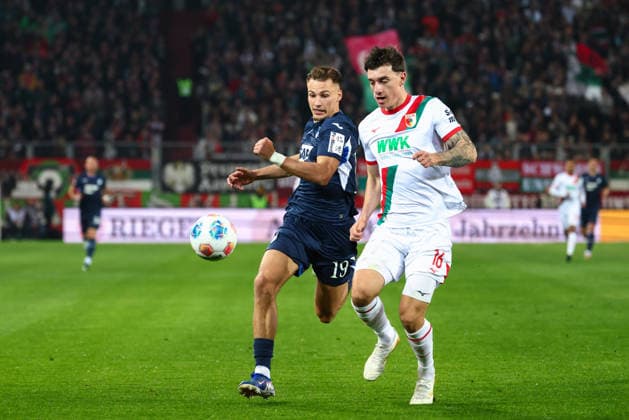 Tim Lemperle (19, TSG 1899 Hoffenheim) und Cedric Zesiger (16, FC Augsburg) beim Spiel zwischen FC Augsburg v TSG 1899 Hoffenheim, Fußball, Herren, Bundesliga, 2025 2026, 29.Spieltag am 10.04.2026 in Augsburg, WWK ARENA. DFL and DFB regulations prohibit any use of photographs as image sequences and or quasi-video. Bayern Deutschland *** Tim Lemperle 19, TSG 1899 Hoffenheim and Cedric Zesiger 16, FC Augsburg at the match between FC Augsburg v TSG 1899 Hoffenheim, Football, Men, Bundesliga, 2025 2026, Matchday 29 on 10 04 2026 in Augsburg, WWK ARENA DFL and DFB regulations prohibit any use of photographs as image sequences and or quasi video Bayern Germany