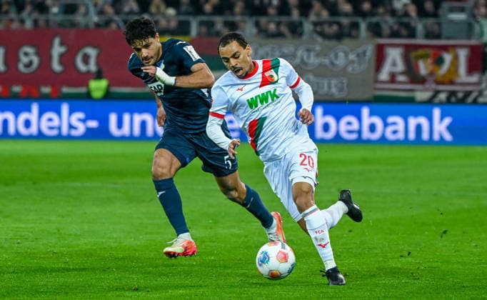 10.04.2026, xemx, Fussball 1.Bundesliga, FC Augsburg - TSG Hoffenheim v.l. Ozan Kabak (TSG Hoffenheim), Alexis Claude-Maurice (FC Augsburg) Zweikampf, Aktion, action, battle for the ball (DFL DFB REGULATIONS PROHIBIT ANY USE OF PHOTOGRAPHS as IMAGE SEQUENCES and or QUASI-VIDEO) Augsburg *** 10 04 2026, xemx, Soccer 1 Bundesliga, FC Augsburg TSG Hoffenheim v l Ozan Kabak TSG Hoffenheim , Alexis Claude Maurice FC Augsburg Zweikampf, Aktion, action, battle for the ball DFL DFB REGULATIONS PROHIBIT ANY USE OF PHOTOGRAPHS as IMAGE SEQUENCES and or QUASI VIDEO Augsburg