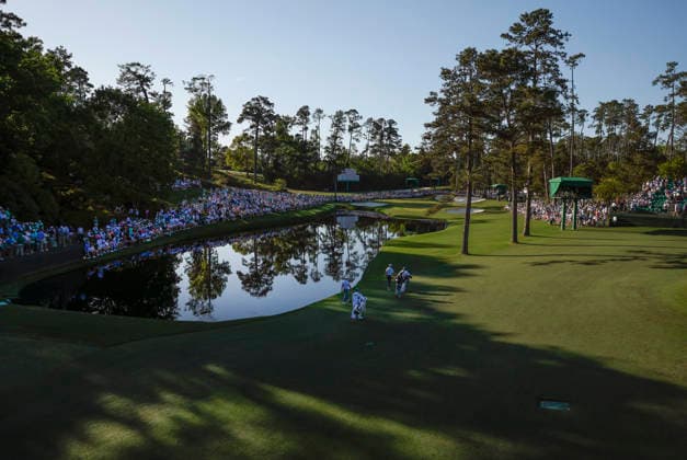 Rory McIlroy of Northern Ireland, Cameron Young and amateur Mason Howell walk to the 16th tee during the second day of the Masters Tournament at Augusta National Golf Club on Friday, April 10, 2026, in Augusta, Georgia.  AUG20260410859 JOHNxANGELILLO