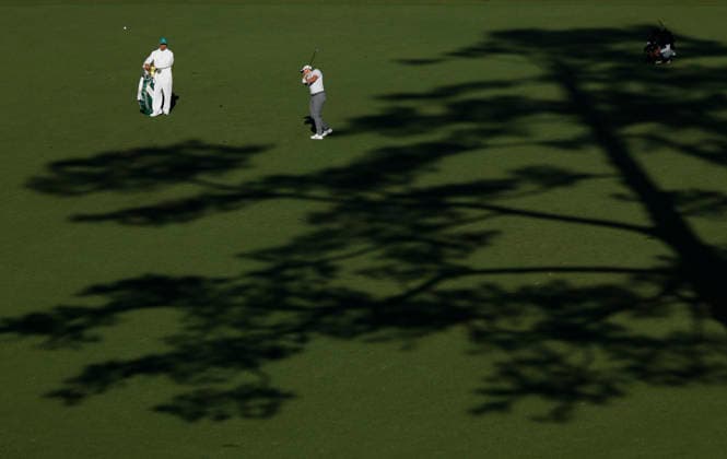 Rory McIlroy of Northern Ireland hits his third shot to the 15th green during the second day of the Masters Tournament at Augusta National Golf Club on Friday, April 10, 2026, in Augusta, Georgia.  AUG20260410860 JOHNxANGELILLO