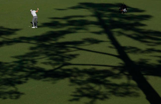 Rory McIlroy of Northern Ireland hits his third shot to the 15th green during the second day of the Masters Tournament at Augusta National Golf Club on Friday, April 10, 2026, in Augusta, Georgia.  AUG20260410861 JOHNxANGELILLO