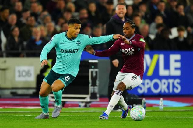 Joao Gomes of Wolverhampton Wanderers and Kyle Walker-Peters of West Ham United West Ham United v Wolverhampton Wanderers, Premier League, Football, London Stadium, London, UK - 10 Apr 2026London London Stadium United Kingdom EDITORIAL USE ONLY No use with unauthorised audio, video, data, fixture lists, club league logos or live services. Online in-match use limited to 120 images, no video emulation. No use in betting, games or single club league player publications. Copyright: xJavierxGarcia Shutterstockx 16823405de