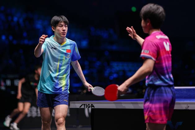 TAIYUAN, CHINA - APRIL 11: Wen Ruibo of China high five with Hiroto Shinozuka of Japan in the Men s Singles Quarterfinal match on day 5 of WTT Contender Taiyuan 2026 at Taiyuan Binhe Sports Center on April 11, 2026 in Taiyuan, Shanxi Province of China.  Copyright: xVCGx 111634091766