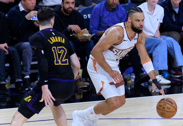 April 10, 2026, Los Angeles, California, USA: Dillon Brooks 3 of the Phoenix Suns drives past Jake LaRavia 12 of the Los Angeles Lakers during their regular season NBA, Basketball Herren, USA game on Friday April 10, 2026 at Crypto.com Arena in Los Angeles, California. Lakers defeat Suns, 101-73. ARIANA RUIZ PI Los Angeles USA - ZUMAp124 20260410_zaa_p124_042 Copyright: xArianaxRuizx