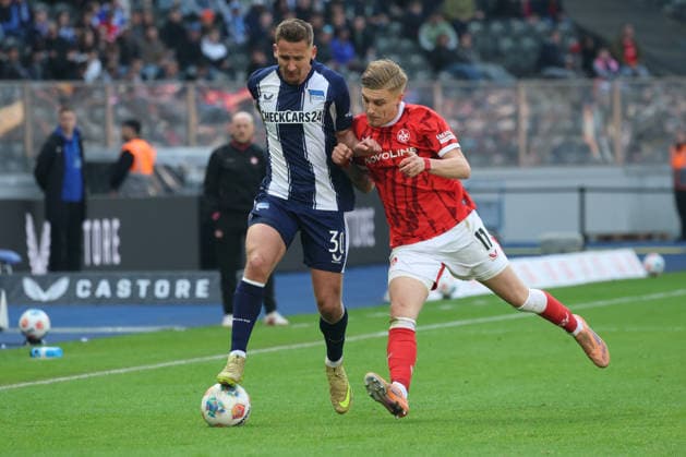 BERLIN, DEUTSCHLAND - APRIL 11: Paul Seguin (Hertha, 30) in the duel for the ball with Norman Bassette (Kaiserslautern, 17), during the match in the 2. German Bundesliga: Hertha BSC - 1. FC Kaiserslautern at Olympiastadion on matchday 29 on April 11, 2026 in Berlin, Deutschland. DFB regulations prohibit any use of photographs as image sequences and or quasi video. Berlin Deutschland Copyright: xO.Frankex