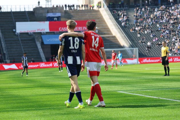 BERLIN, DEUTSCHLAND - APRIL 11: Jacob Rasmussen (Kaiserslautern, 14) and Luca Schuler (Hertha, 18), during the match in the 2. German Bundesliga: Hertha BSC - 1. FC Kaiserslautern at Olympiastadion on matchday 29 on April 11, 2026 in Berlin, Deutschland. DFB regulations prohibit any use of photographs as image sequences and or quasi video. Berlin Deutschland Copyright: xO.Frankex