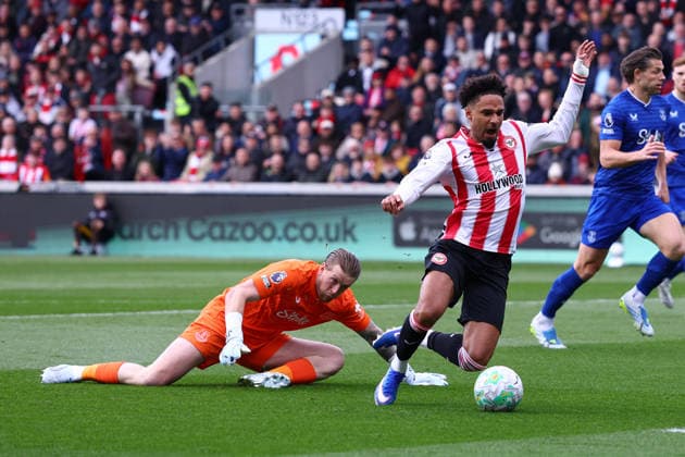 London, England, 11th April 2026. Kevin Schade of Brentford is fouled by Jordan Pickford of Everton and wins a penalty during the Brentford vs Everton Premier League match at Gtech Community Stadium, London. Picture credit should read: Paul Terry Sportimage EDITORIAL USE ONLY. No use with unauthorised audio, video, data, fixture lists, club league logos or live services. Online in-match use limited to 120 images, no video emulation. No use in betting, games or single club league player publications. SPI_014_PT_Brentford_Everton SPI-4678-0014