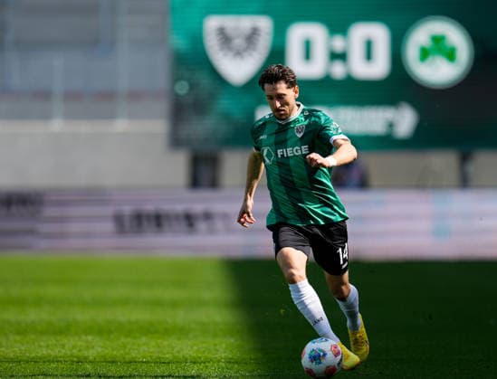 April 11, 2026, Muenster, Germany: SC Preussen Muenster midfielder HARALAMBOS MAKRIDIS (14) moves the ball during the match between SC Pruessen Muenster and SpVgg Greuther Fuerth in the 2. Bundesliga on April 11, 2026, in Muenster, Germany...DFL REGULATIONS PROHIBIT ANY USE OF PHOTOGRAPHS AS IMAGE SEQUENCES AND OR QUASI-VIDEO Muenster Germany - ZUMAc201 20260411_zap_c201_026 Copyright: xScottxColemanx