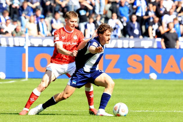 DEU, DFL, 2 FBL, Hertha BSC vs 1 FC Kaiserslautern, 11 04 2026, Berliner Olympiastadion, Berlin, DEU, DFL, 2 FBL, Hertha BSC vs 1 FC Kaiserslautern, im Bild Maurice Krattenmacher Hertha BSC Berlin 14 , FABIAN KUNZE 1 FC Kaiserslautern 6 DFL regulations prohibit any use of Photographs as image sequences and or quasi video nordphotoxGmbHx xEngler nph00076