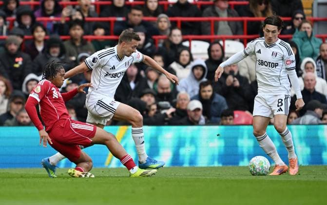 Timothy Castagne of Fulham is tackled by Rio Ngumoha of Liverpool Liverpool v Fulham, Premier League, Football, Anfield, Liverpool, UK - 11 Apr 2026Liverpool Anfield United Kingdom EDITORIAL USE ONLY No use with unauthorised audio, video, data, fixture lists, club league logos or live services. Online in-match use limited to 120 images, no video emulation. No use in betting, games or single club league player publications. Copyright: xAnnaxGowthorpe Shutterstockx 16823590ap