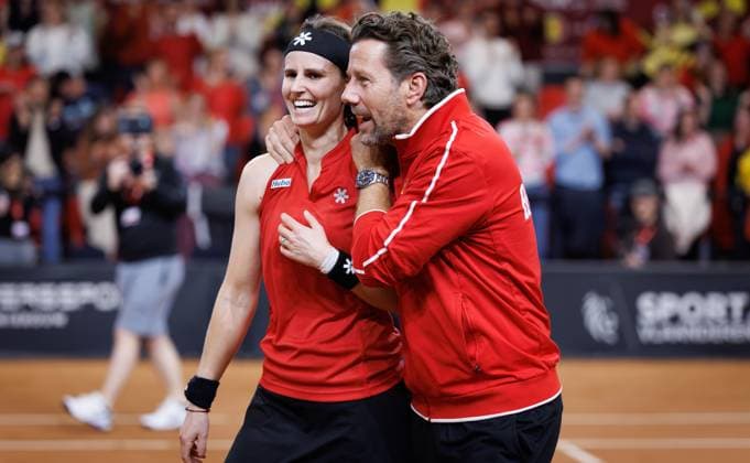 Belgian Greet Minnen and Belgian team captain Wim Fissette celebrate after the fourth game between Belgian Minnen and US Jovic on the second day of the qualifiers of the Billie Jean King Cup tennis between Belgium and the USA, in Oostende, Belgium, on Saturday 11 April 2026. The meeting takes place on 10 and 11th April. PHOTO BENOITxDOPPAGNE  x170494755x