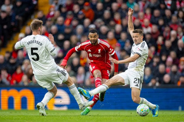 Football - FA Premier League - Liverpool FC v Fulham FC LIVERPOOL, ENGLAND - Saturday, April 11, 2026: Liverpool s Cody Gakpo has a shot on goal as Fulham s Joachim Andersen (L) and Timothy Castagne (R) are charging in during the FA Premier League match between Liverpool FC and Fulham FC at Anfield. (Photo by David Rawcliffe Propaganda) LIVERPOOL Anfield MERSEYSIDE ENGLAND  Copyright: xDavidxRawcliffex P2026-04-11-Liverpool_Fulham-91