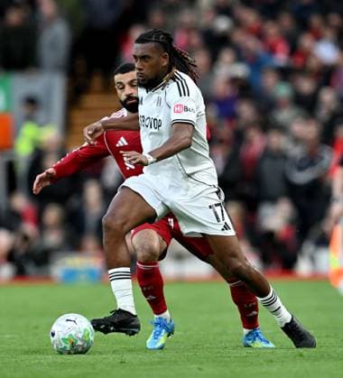 Mohamed Salah of Liverpool and Alex Iwobi of Fulham Liverpool v Fulham, Premier League, Football, Anfield, Liverpool, UK - 11 Apr 2026Liverpool Anfield United Kingdom EDITORIAL USE ONLY No use with unauthorised audio, video, data, fixture lists, club league logos or live services. Online in-match use limited to 120 images, no video emulation. No use in betting, games or single club league player publications. Copyright: xAnnaxGowthorpe Shutterstockx 16823590bh