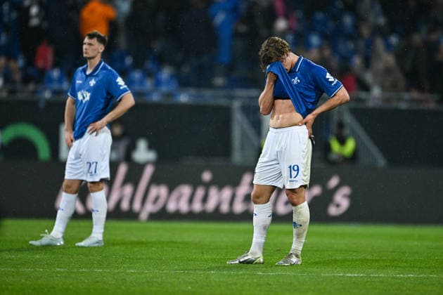 Fynn Lakenmacher SV Darmstadt 1898, 19 and Bartosz Bialek SV Darmstadt 1898, 27 are disappointed with the defeat, GER, SV Darmstadt 98 vs Hannover 96, Soccer 2 Bundesliga, Matchday 29, Season 2025 2026, 11 04 2026 DFL regulations prohibit any use of photographs as image sequences and or quasi video GER, SV Darmstadt 98 vs Hannover 96, Soccer 2 Bundesliga, Matchday 29, Season 2025 2026, 11 04 2026 Darmstadt Copyright: xEibner-Pressefoto FlorianxWiegandx EP_FWD