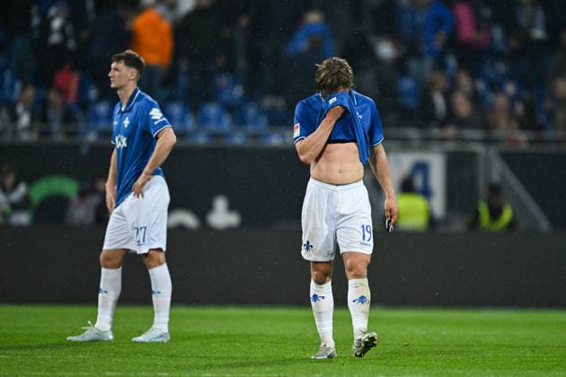 Fynn Lakenmacher SV Darmstadt 1898, 19 and Bartosz Bialek SV Darmstadt 1898, 27 are disappointed with the defeat, GER, SV Darmstadt 98 vs Hannover 96, Soccer 2 Bundesliga, Matchday 29, Season 2025 2026, 11 04 2026 DFL regulations prohibit any use of photographs as image sequences and or quasi video GER, SV Darmstadt 98 vs Hannover 96, Soccer 2 Bundesliga, Matchday 29, Season 2025 2026, 11 04 2026 Darmstadt Copyright: xEibner-Pressefoto FlorianxWiegandx EP_FWD