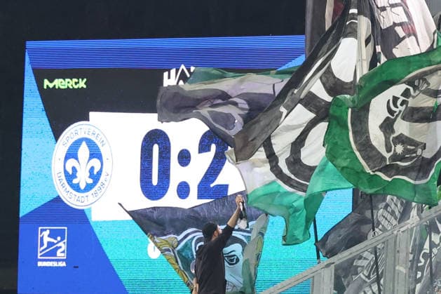 11 04 2026, xrekx, Soccer 2 Bundesliga, SV Darmstadt 98 Hannover 96 v l Final Score 0 2 Scoreboard, Videowall, Scoreboard, Info, Advertising Hannover Fans ,Mood, Scarves, Ultras, Spectators, Visitors, Choreo, Choreography, atmosphere, scarves, spectators, visitors DFL DFB REGULATIONS PROHIBIT ANY USE OF PHOTOGRAPHS as IMAGE SEQUENCES and or QUASI VIDEO Darmstadt