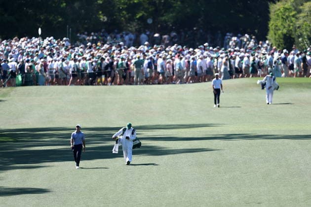 Golf 2026 Masters Tournament - Round 3 Rory McIlroy of Northern Ireland (L) and Sam Burns of the US (2-R) walk up the seventh fairway as patrons cross in Round 3 of the 2026 Masters tournament in August, Georgia, USA, 11 April 2026. Augusta United States  Copyright: xCHRISxTORRESx