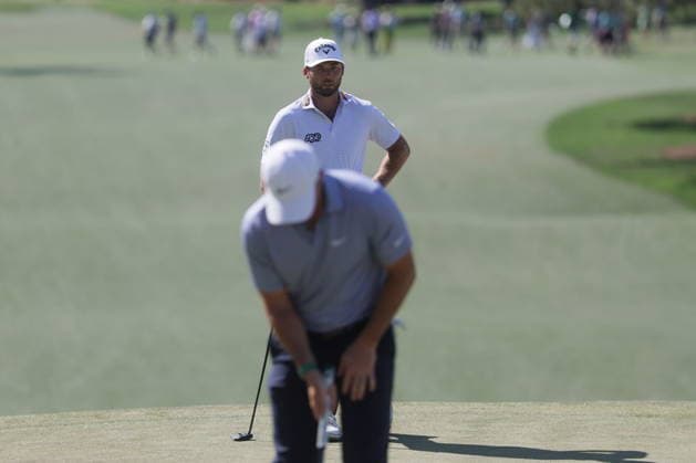 Golf 2026 Masters Tournament - Round 3 Sam Burns of the US (Background) waits for Rory McIlroy of Northern Ireland to putt on the seventh green in Round 3 of the 2026 Masters tournament in August, Georgia, USA, 11 April 2026. Augusta United States  Copyright: xCHRISxTORRESx