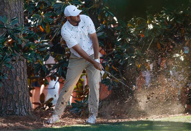 Scottie Scheffler hits out of the pine straw to the 18th green during the third round of the Masters Tournament at Augusta National Golf Club on Saturday, April 11, 2026, in Augusta, Georgia.  AUG20260411820 JOHNxANGELILLO
