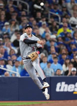 April 11, 2026, Toronto, On, CANADA: Minnesota Twins third baseman Ryan Kreidler (5) makes a leaping throw to out Toronto Blue Jays designated hitter George Springer at first base during third inning American League MLB, Baseball Herren, USA baseball action in Toronto on Saturday, April 11, 2026. Canada News - April 11, 2026  - ZUMAc35_ 20260411_zaf_c35_084 Copyright: xNathanxDenettex