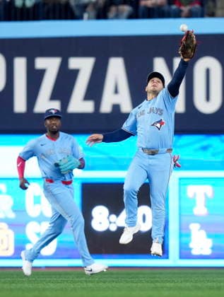 April 11, 2026, Toronto, On, CANADA: Toronto Blue Jays outfielder Daulton Varsho (5) misses a ball as teammate Jesus Sanchez (12) looks on during third inning American League MLB, Baseball Herren, USA baseball action against Minnesota Twins in Toronto on Saturday, April 11, 2026. Canada News - April 11, 2026  - ZUMAc35_ 20260411_zaf_c35_088 Copyright: xNathanxDenettex