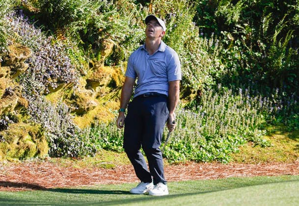 Rory McIlroy of Northern Ireland reacts after a chip shot on the 12th hole during the third round of the Masters Tournament at Augusta National Golf Club on Saturday, April 11, 2026, in Augusta, Georgia.  AUG20260411837 JOHNxANGELILLO