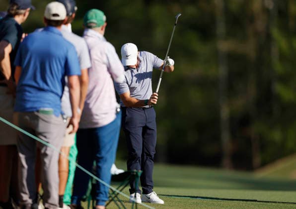 Rory McIlroy of Northern Ireland reacts after his third shot to the 13th green during the third round of the Masters Tournament at Augusta National Golf Club on Saturday, April 11, 2026, in Augusta, Georgia.  AUG20260411849 JOHNxANGELILLO