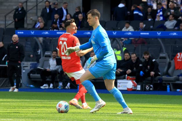 DEU, DFL, 2 FBL, Hertha BSC vs 1 FC Kaiserslautern, 11 04 2026, Berliner Olympiastadion, Berlin, DEU, DFL, 2 FBL, Hertha BSC vs 1 FC Kaiserslautern, im Bild Tjark Ernst Hertha BSC Berlin 1 , MERGIM BERISHA 1 FC Kaiserslautern 20 DFL regulations prohibit any use of Photographs as image sequences and or quasi video nordphotoxGmbHx xEngler nph00076