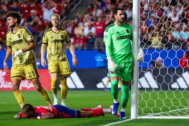 April 11, 2026, Frisco, Texas, USA: FRISCO, TX : St. Louis Frisco SC midfielder Dante Polvara (21), St. Louis Frisco SC defender Timo Baumgartl (32) and St. Louis Frisco SC goalkeeper Roman BoÂ¼rki (1) surround FC Dallas defender Shaq Moore (18) lays on the ground after a missed goal attempt during their match on Saturday at Toyota Stadium in Frisco. 2026 MLS, Fussball Herren, USA Soccer : FC Dallas 1:1 St. Louis CITY SC  - ZUMAm257 20260411_zsp_m257_020 Copyright: xBrianxMcLeanx