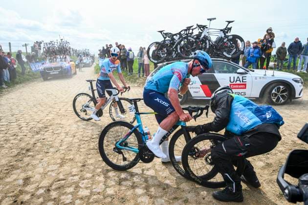Paris - Roubaix Hauts-de-France 2026 Cycling Race ROUBAIX, FRANCE - APRIL 12 : Syritsa Gleb (RUS) of XDS Astana Team coping with a flat tire during the 123rd edition of Paris - Roubaix Hauts-de-France an UCI World Tour 1.UWT one day cycling road race for Men Elite of 258 km with start in Compiegne and finish in Roubaix on April 12, 2026 in Roubaix, France, 12 04 2026 ( Motordriver Kenny Verfaillie - Roubaix France  Copyright: xVincentxKalutx
