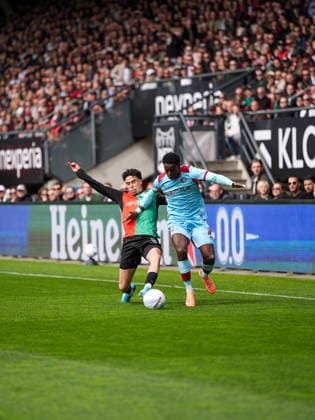 Eredivisie: NEC Nijmegen v Feyenoord Rotterdam Nijmegen - Sami Ouaissa of NEC Nijmegen, Jordan Lotomba of Feyenoord during the thirtieth competition round of the 2025 2026 Eredivisie season. The match is set between NEC Nijmegen and Feyenoord Rotterdam at Goffertstadion on 12 April 2026 in Nijmegen, The Netherlands. Copyright: xTomxBodex