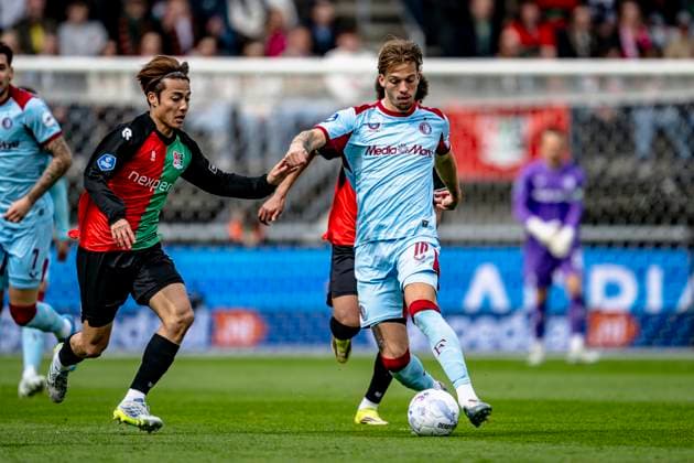NIJMEGEN lr NEC player Kodai Sano, Feyenoord Rotterdam midfielder Luciano Valente during the Dutch Vriendenloterij Eredivisie match between NEC and Feyenoord at De Goffert stadium on April 12, 2026 in Nijmegen, the Netherlands Photo by Stefan Koops EYE4IMAGES DeFodi Images