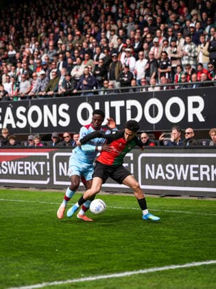Eredivisie: NEC Nijmegen v Feyenoord Rotterdam Nijmegen - Jordan Lotomba of Feyenoord, Sami Ouaissa of NEC Nijmegen during the thirtieth competition round of the 2025 2026 Eredivisie season. The match is set between NEC Nijmegen and Feyenoord Rotterdam at Goffertstadion on 12 April 2026 in Nijmegen, The Netherlands. Copyright: xTomxBodex