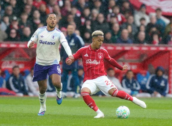 Nottingham, England, 12th April 2026. Youri Tielemans of Aston Villa and Omari Hutchinson of Nottingham Forest (r) during the Nottingham Forest vs Aston Villa Premier League match at the City Ground, Nottingham. Picture credit should read: Andrew Yates Sportimage EDITORIAL USE ONLY. No use with unauthorised audio, video, data, fixture lists, club league logos or live services. Online in-match use limited to 120 images, no video emulation. No use in betting, games or single club league player publications. SPI_019_AY_Forest_Villa SPI-4682-0019