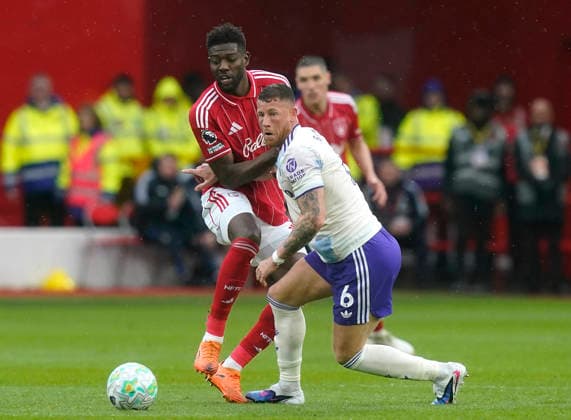 Nottingham, England, 12th April 2026. Ibrahim Sangare of Nottingham Forest tackles Ross Barkley of Aston Villa during the Nottingham Forest vs Aston Villa Premier League match at the City Ground, Nottingham. Picture credit should read: Andrew Yates Sportimage EDITORIAL USE ONLY. No use with unauthorised audio, video, data, fixture lists, club league logos or live services. Online in-match use limited to 120 images, no video emulation. No use in betting, games or single club league player publications. SPI_025_AY_Forest_Villa SPI-4682-0025