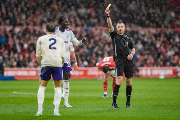 Premier League: Nottingham Forest v Aston Villa Referee Michael Salisbury gives a yellow card to Matty Cash of Aston Villa during the Premier League match Nottingham Forest vs Aston Villa at City Ground, Nottingham, United Kingdom on 12 April 2026 (Photo by Maynard Manyowa News Images) Nottingham City Ground Nottinghamshire United Kingdom Copyright: xMaynardxManyowa NewsxImagesx