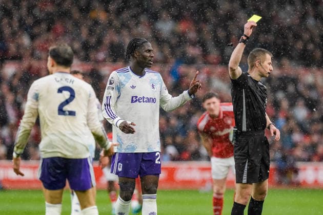 Premier League: Nottingham Forest v Aston Villa Referee Michael Salisbury gives a yellow card to Matty Cash of Aston Villa during the Premier League match Nottingham Forest vs Aston Villa at City Ground, Nottingham, United Kingdom on 12 April 2026 (Photo by Maynard Manyowa News Images) Nottingham City Ground Nottinghamshire United Kingdom Copyright: xMaynardxManyowa NewsxImagesx