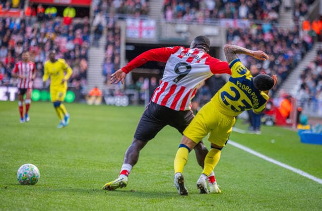 Sunderland v Tottenham Hotspur, Premier League, Football, Stadium of Light, Sunderland UK - 12 Apr 2026 Brian Brobbey of Sunderland Association Football Club elbows Pedro Porro of Tottenham Hotspur Football Club Sunderland Stadium Of Light Tyne and Wear UK, UK NEWSPAPERS OUT Copyright: xAdamxCookx