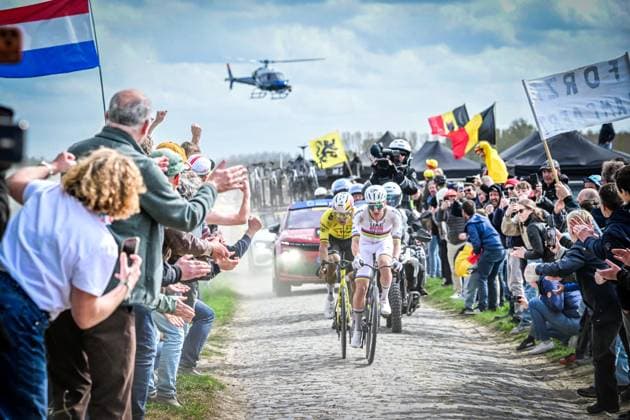 Belgian Wout van Aert of Team Visma-Lease a Bike and Slovenian Tadej Pogacar of UAE Team Emirates-XRG pictured in action during the men s Paris-Roubaix cycling race, Sunday 12 April 2026, around Roubaix, France. The 123rd edition of Paris-Roubaix cycling races will take on Sunday, with the women riding 143,1 km the men riding 258,3 km on Sunday. POOLxBERNARDxPAPON  x170564622x