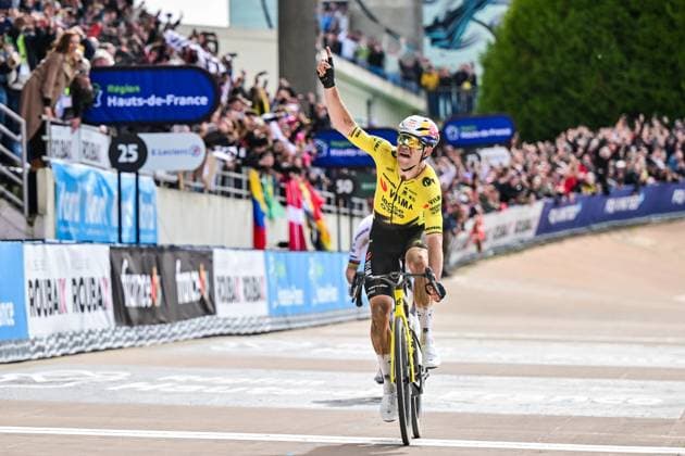 Belgian Wout van Aert of Team Visma-Lease a Bike celebrates as he crosses the finish line to win the men s Paris-Roubaix cycling race, Sunday 12 April 2026, around Roubaix, France. The 123rd edition of Paris-Roubaix cycling races will take on Sunday, with the women riding 143,1 km the men riding 258,3 km on Sunday. DIRKxWAEM  x170568172x