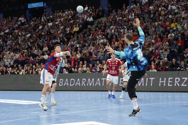 2026 04 12 xfsx Daikin HBL Handballl 1 Bundesliga Hamburger Sportverein Handball THW Kiel v l Nicolaj Jorgensen 11, HSV Hamburg Handball , Goalkeeper Andreas Wolff THW Kiel ,33 Copyright: HMBxMedia FernandoxSoares