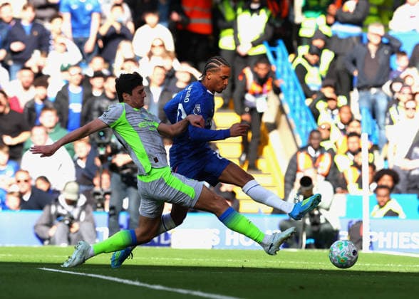 12th April 2026; Stamford Bridge, Chelsea, London, England: Premier League Football, Chelsea versus Manchester City; Joao Pedro of Chelsea takes a shot on goal past Abdukodir Khusanov of Manchester City JPxFletcher
