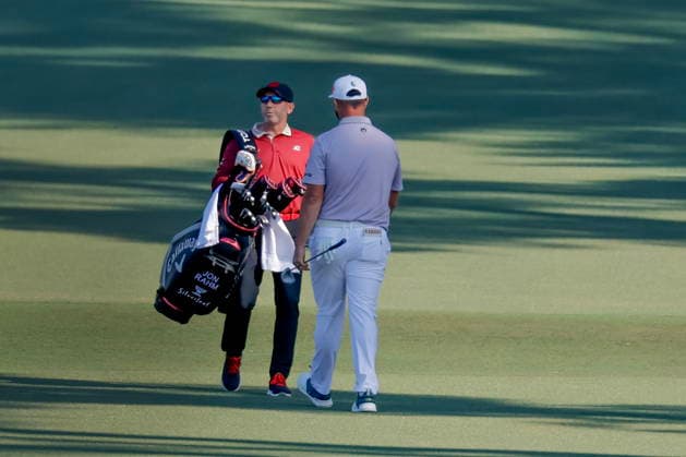 Golf - Masters Tournament round 4 Sergio Garcia (L) carries the golf bag for fellow Spaniard Jon Rahm (R) on the fairway of the second hole during the final round of the 2026 Masters Tournament at the Augusta National Golf Club in Augusta, Georgia, USA, 12 April 2026. AUGUSTA GEORGIA United States  Copyright: xERIKxS.xLESSERx